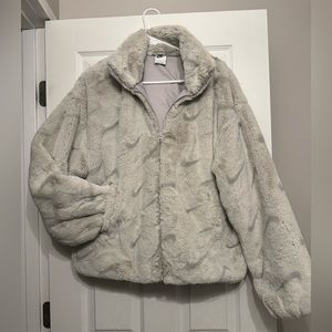 grey plush nike jacket.